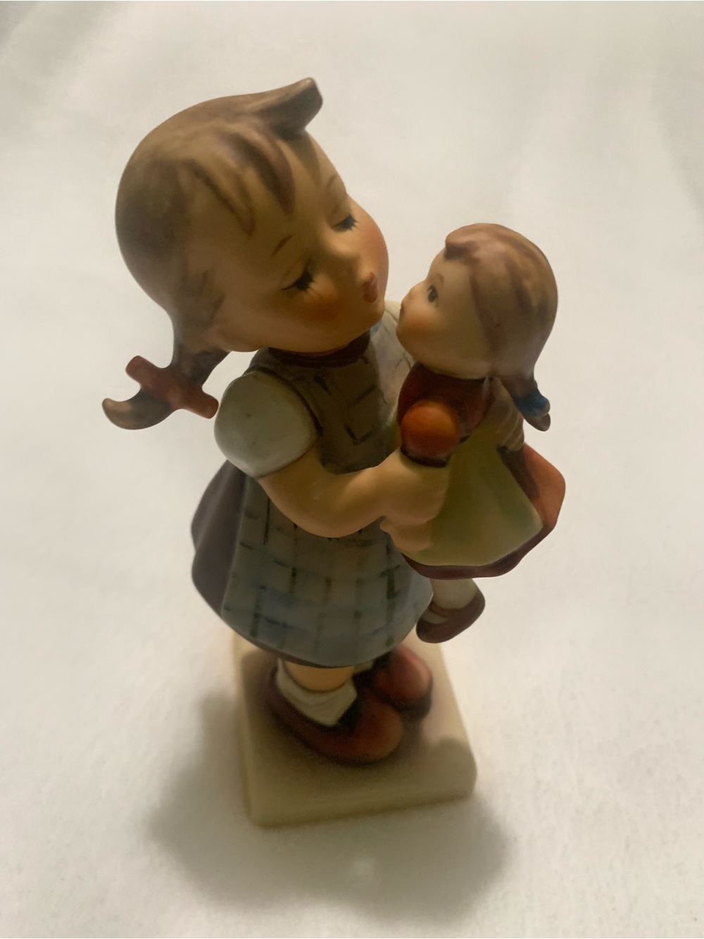 Vintage Goebel Hummel Porcelain
Figurine #311 "Kiss Me" Girl With Doll 
6" Tall